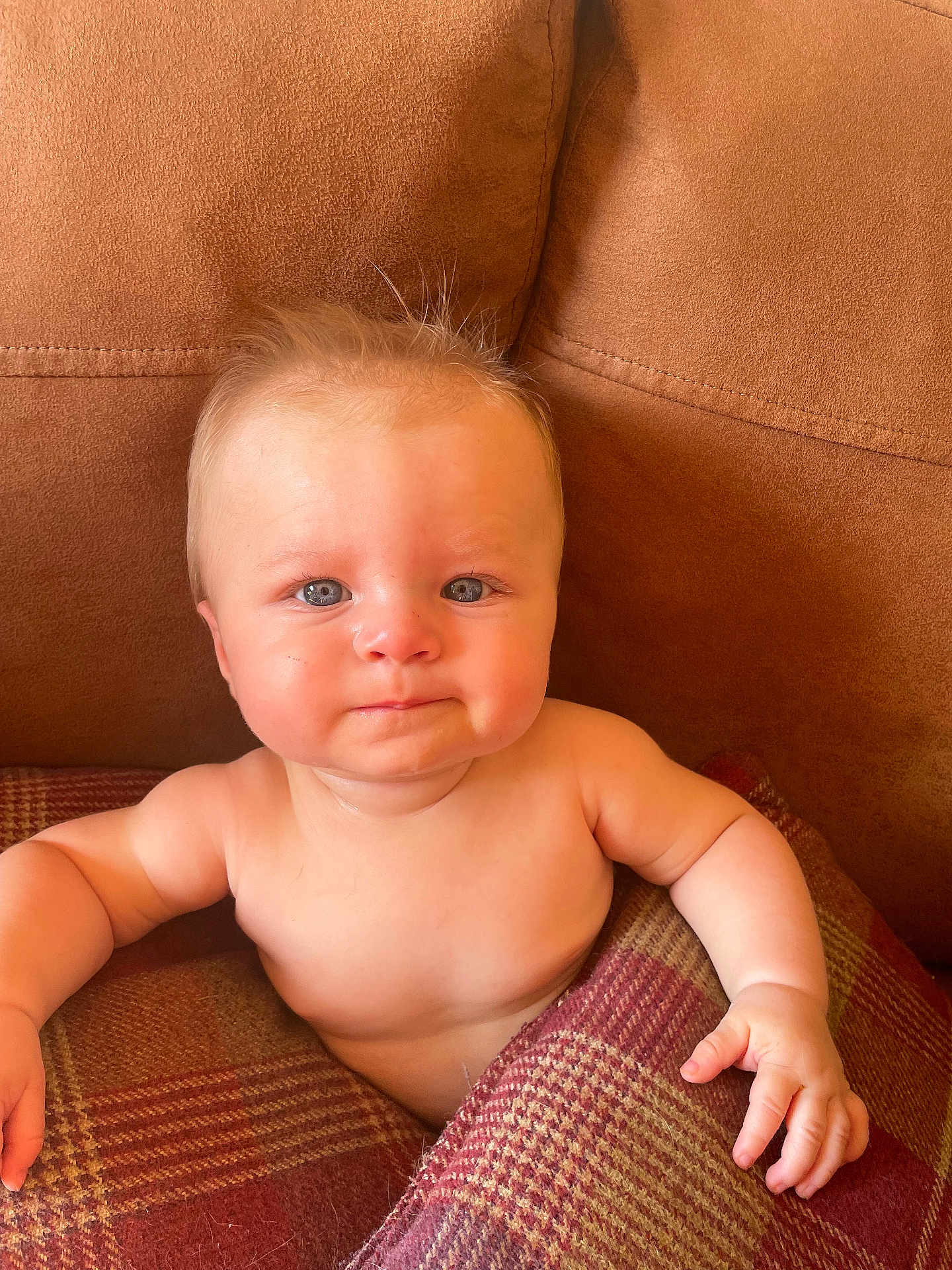 Arthur-James joined the competition — help win amazing prizes! baby, child, infant, face, blue_eyes, blanket, plaid, couch, brown, skin, toddler, portrait, cute, indoors, furniture, sitting, expression, person, hair, soft