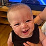 Arthur-James joined the competition — help win amazing prizes! baby, child, smiling, face, hand, ring, lipstick_marks, cheeks, forehead, black_clothing, indoor, wood_floor, furniture, television, person, happy, closeup, skin, young_child, holding
