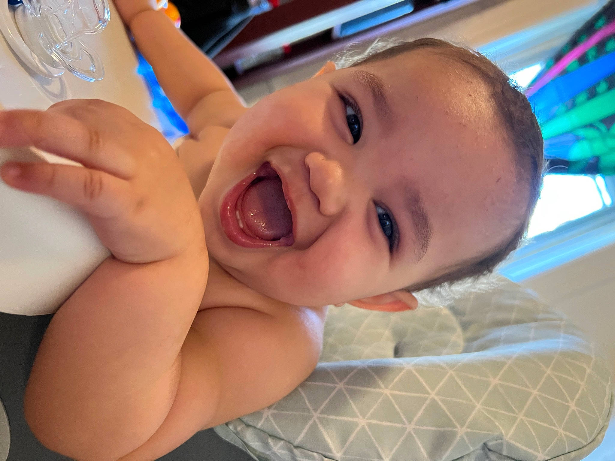 Kyair is registered to the contest to win money with this photo: arm, baby, blue, cheek, ear, eyebrow, eyelash, finger, gesture, happy, iris, lip, mouth, neck, nose, person, product, skin, smile, toddler