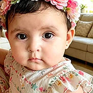 Megan Victoria joined the competition — help win amazing prizes! baby, child, couch, curly_hair, cute, dress, earrings, expression, eyes, face, flower_crown, furniture, home, indoor, natural_light, person, portrait, skin, sleeves, young_child