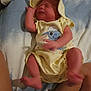 Hope joined the competition — help win amazing prizes! newborn, baby, infant, yellow_clothing, hat, bed, blanket, tattoo, leg, blue_sheet, white_sheet, cartoon_character, person, skin, sleepwear, lying_down, indoors, human, infant_clothing, cute