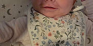 Hope joined the competition — help win amazing prizes! baby, infant, smiling, face, hand, bib, floral, striped, sleepwear, bed, sheet, stars, moon, pattern, person, cute, child, newborn, happy, resting