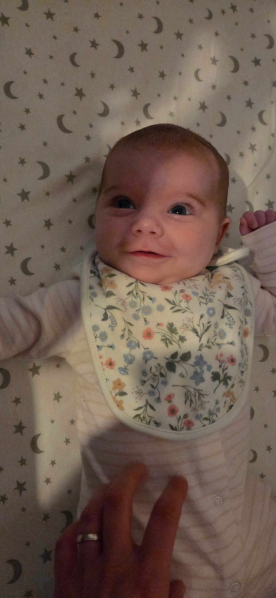 Hope joined the competition — help win amazing prizes! baby, infant, smiling, face, hand, bib, floral, striped, sleepwear, bed, sheet, stars, moon, pattern, person, cute, child, newborn, happy, resting