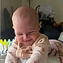 Paisleigh is registered to the contest to win money with this photo: baby, infant, smile, face, hands, clothing, onesie, indoor, lamp, toy, playful, cute, child, person, furniture, home, expression, skin, head, happy