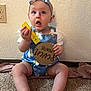 baby, child, infant, blue_romper, headband, bow, carpet, sitting, holding, sign, yellow_label, seven_months, curious, indoor, wall, texture, open_mouth, wide_eyes, person, cute
