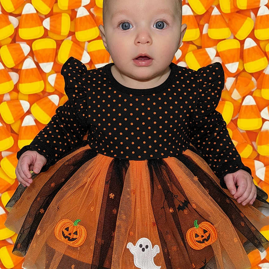 Elise is registered to the contest to win money with this photo: baby, background, black, candy_corn, child, costume, cute, dress, festive, ghost, halloween, holiday, infant, orange, polka_dot, portrait, pumpkin, smiling, standing, tulle