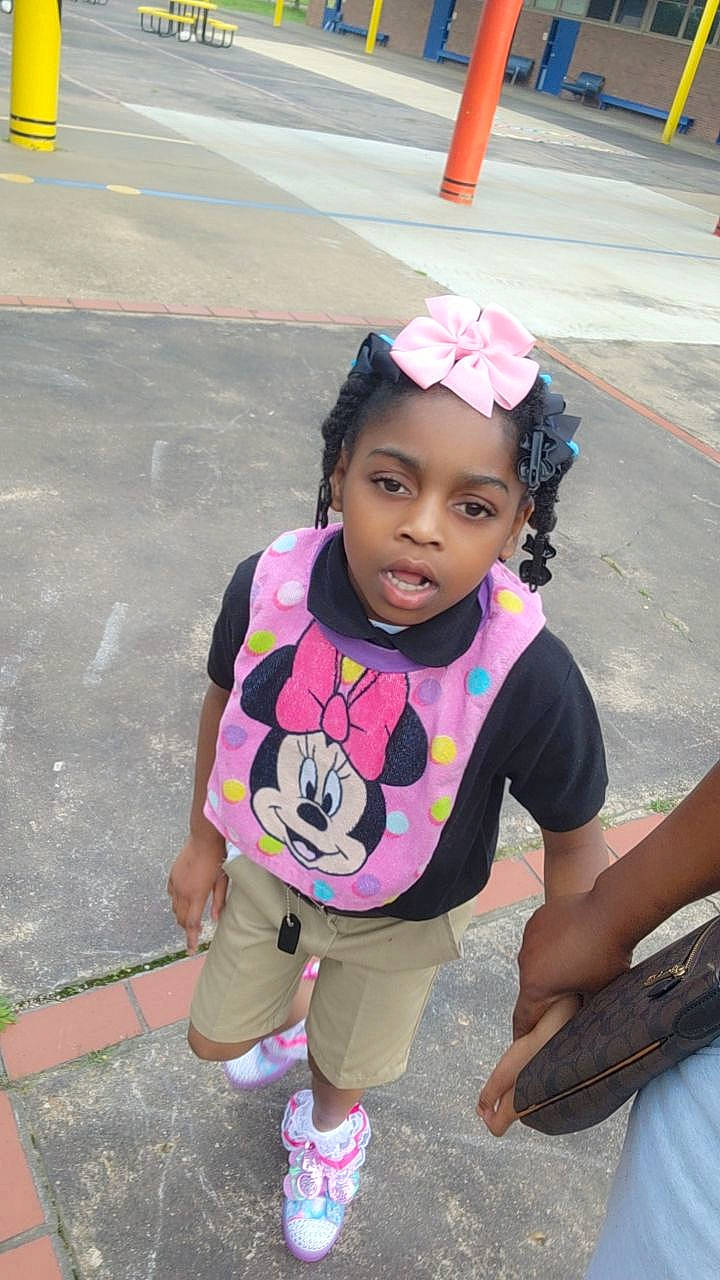 Alyssa is registered to the contest to win money with this photo: asphalt, baby_toddler_clothing, child, fashion_accessory, flip_flops, fun, grass, happy, leisure, magenta, person, pink, plant, recreation, sandal, sleeve, snapshot, street, t_shirt, toddler