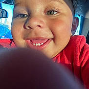 Kane joined the competition — help win amazing prizes! child, toddler, smile, face, eyes, finger, selfie, car, window, sunlight, happy, closeup, red_clothing, skin, cheeks, teeth, hair, interior, daylight, vehicle