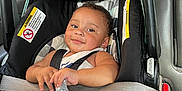 Kane joined the competition — help win amazing prizes! baby, car_seat, infant, bottle, child, seatbelt, vehicle_interior, smile, foot, clothing, safety, seat, straps, cute, happy, person, portrait, car, hand, relaxing
