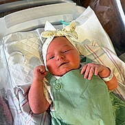 Fiona joined the competition — help win amazing prizes! newborn, baby, infant, hospital, bassinet, blanket, headband, bow, clothing, mint_green, wrapped, cute, sleepy, person, skin, hand, portrait, indoors, baby_wear, hospital_band
