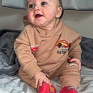 Roy joined the competition — help win amazing prizes! baby, infant, toddler, sitting, hoodie, socks, blanket, bed, curtain, blue_eyes, rosy_cheeks, smile, hand, cute, indoor, portrait, clothing, plush, happy, one_person