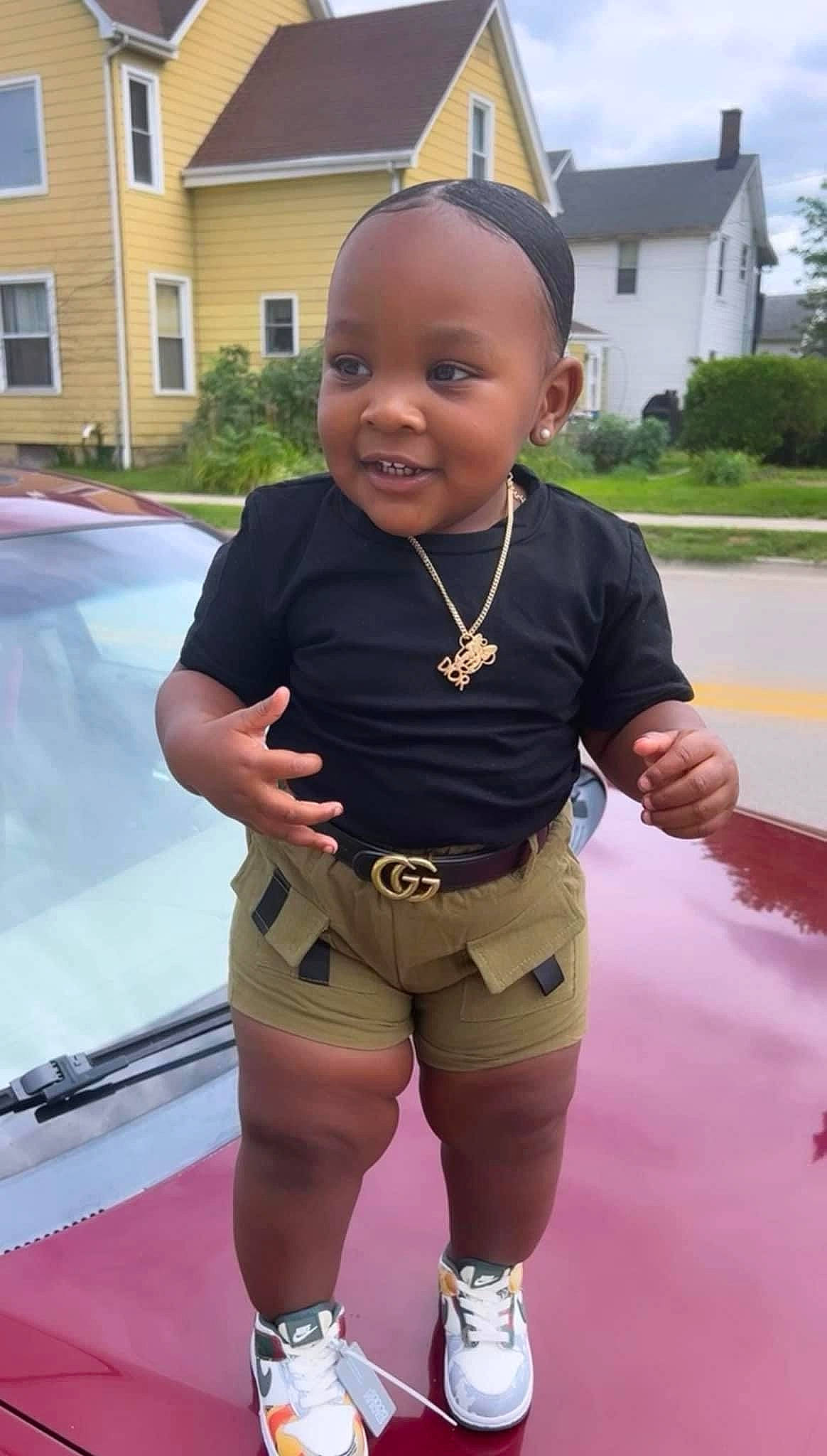 Sandior is registered to the contest to win money with this photo: active_shorts, baby, baby_toddler_clothing, fun, grass, happy, joy, leisure, person, personal_protective_equipment, pink, plant, recreation, sky, sleeve, smile, t_shirt, toddler, vehicle_door, white