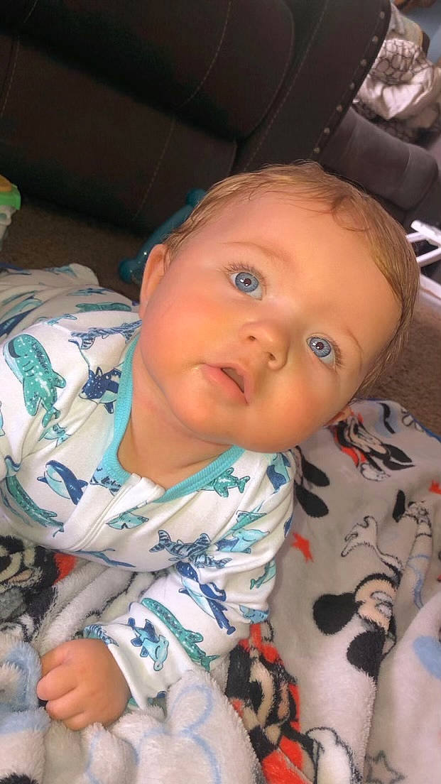 Charlie joined the competition — help win amazing prizes! baby, baby_products, baby_toddler_clothing, cheek, child, chin, comfort, eye, fun, hairstyle, head, iris, linens, mouth, nose, person, room, sitting, skin, sleeve