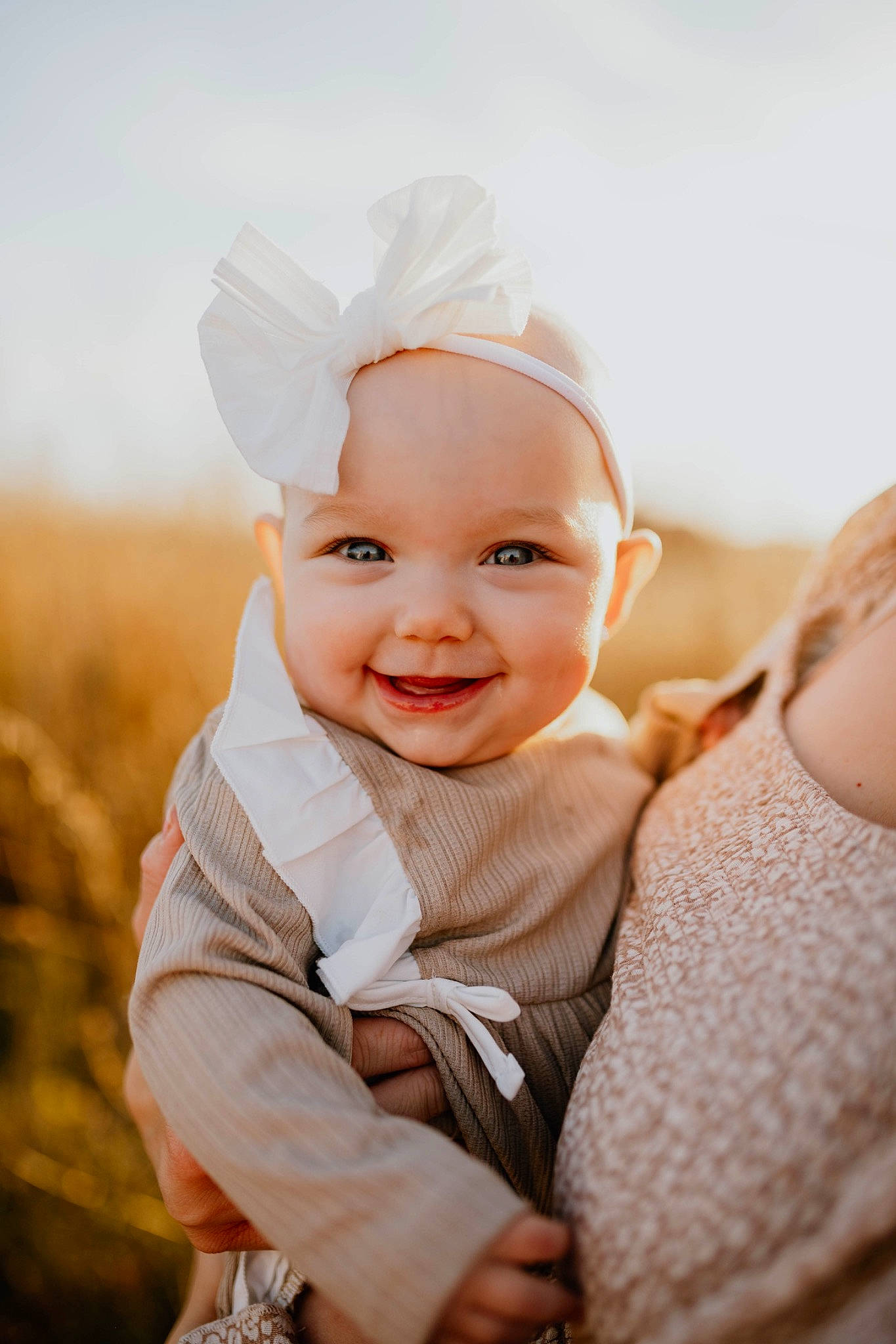 Novalee is registered to the contest to win money with this photo: arm, baby, baby_toddler_clothing, cap, eye, face, flash_photography, gesture, grass, hand, happy, hat, head, headgear, headwear, joy, lip, outerwear, people_in_nature, person