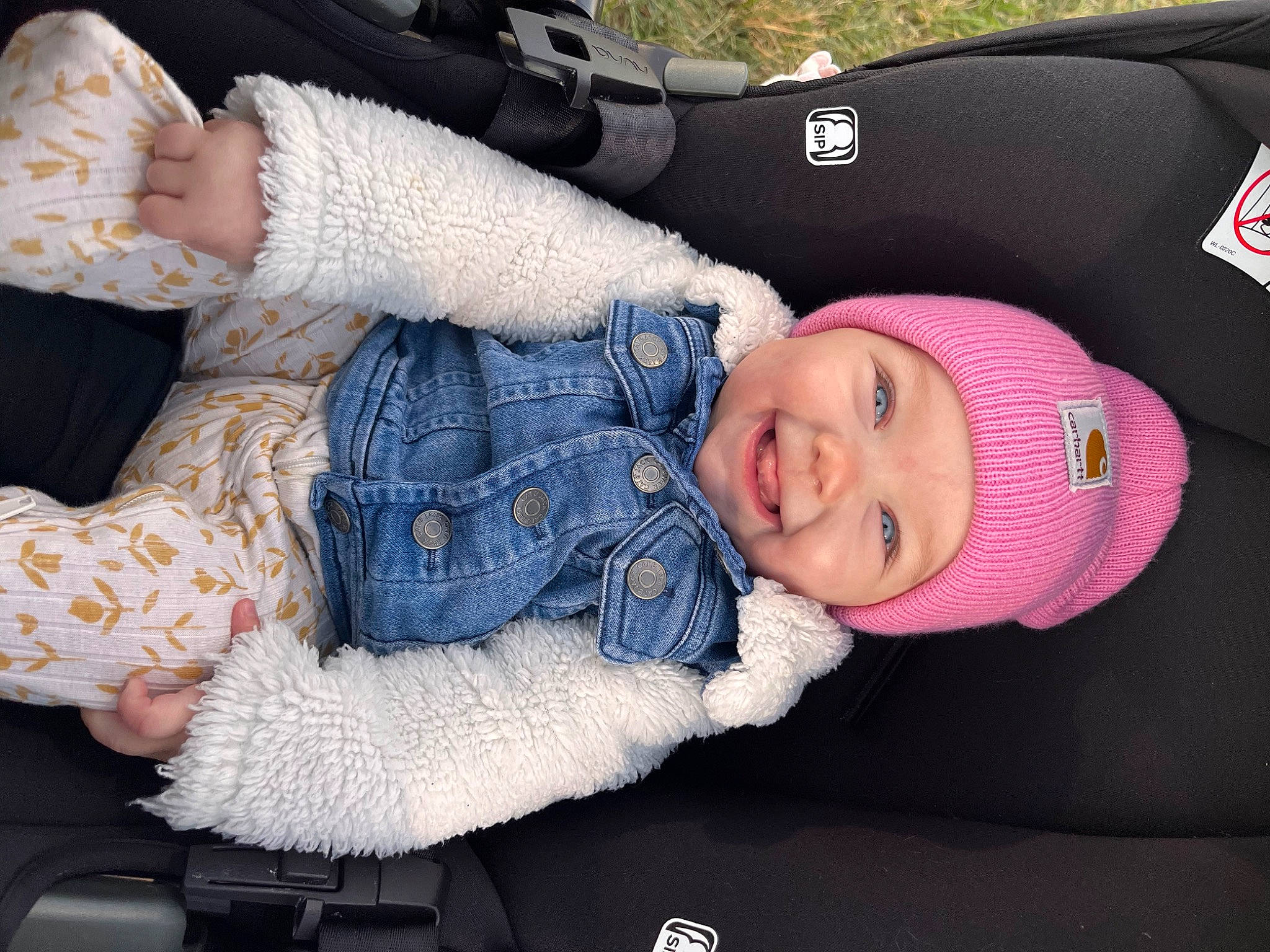 Novalee is registered to the contest to win money with this photo: baby, baby_carriage, baby_products, baby_toddler_clothing, cap, cheek, child, comfort, fashion_accessory, gesture, headwear, human_body, knit_cap, lap, pattern, person, sleeve, toddler, tree, white