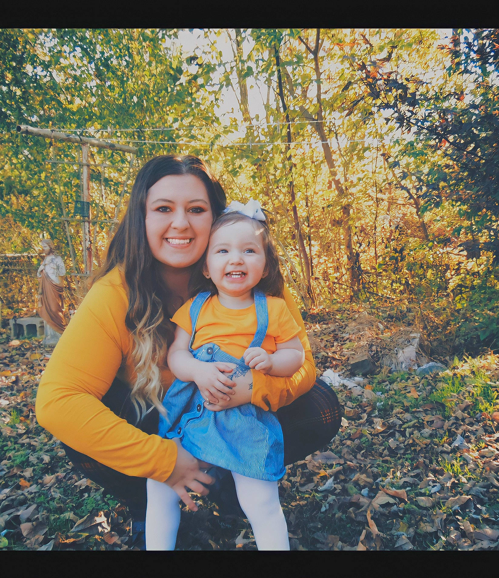 Talia Rose joined the competition — help win amazing prizes! branch, child, facial_expression, flash_photography, forest, fun, gesture, grass, happy, joy, landscape, leaf, leisure, natural_landscape, people_in_nature, person, plant, sitting, smile, toddler