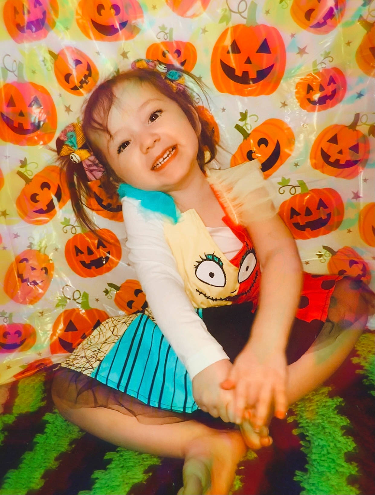 Talia Rose is registered to the contest to win money with this photo: adaptation, baby_toddler_clothing, child, facial_expression, fun, grass, green, happy, joy, leisure, orange, pattern, people_in_nature, person, plant, skin, smile, summer, thigh, toddler
