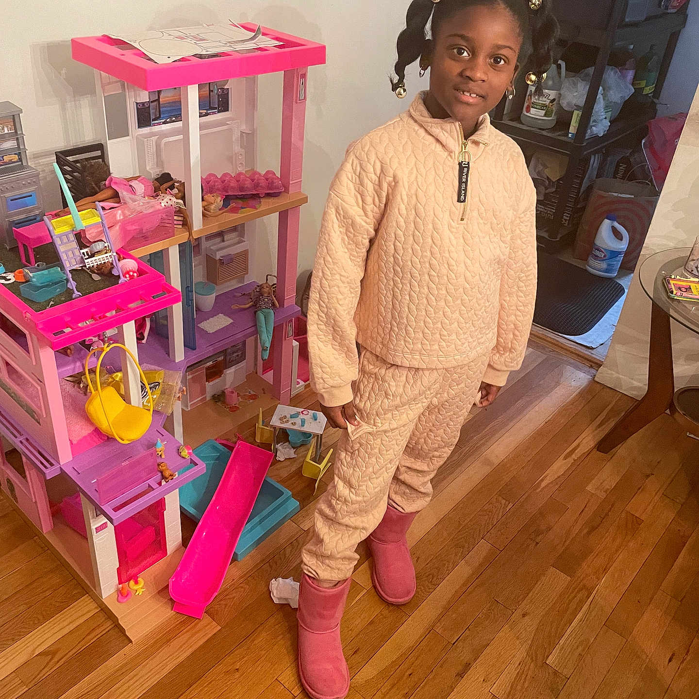 Damaya is registered to the contest to win money with this photo: accessories, architecture, bag, bookcase, boot, building, child, clothing, desk, face, female, footwear, furniture, girl, hair, handbag, happy, hardwood, head, homedecor