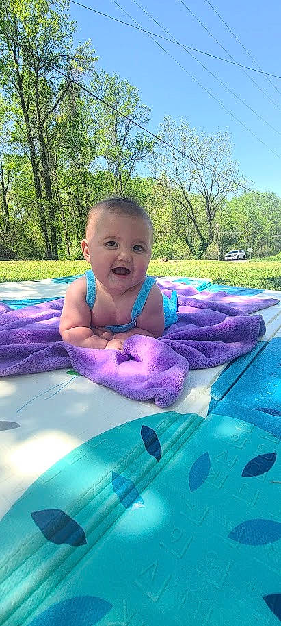 Olivia joined the competition — help win amazing prizes! aqua, automotive_exterior, azure, baby, blue, child, cool, grass, happy, hood, leisure, outdoor_recreation, person, pink, plant, recreation, sky, smile, toddler, tree