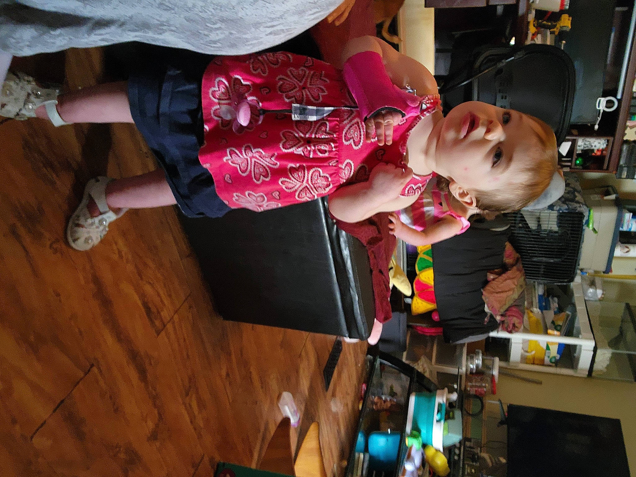 Stella Rose is registered to the contest to win money with this photo: baby, child, clothing, electrical_wiring, flooring, fun, hardwood, hat, machine, magenta, pattern, person, play, room, sandal, t_shirt, toddler, wood, wood_flooring