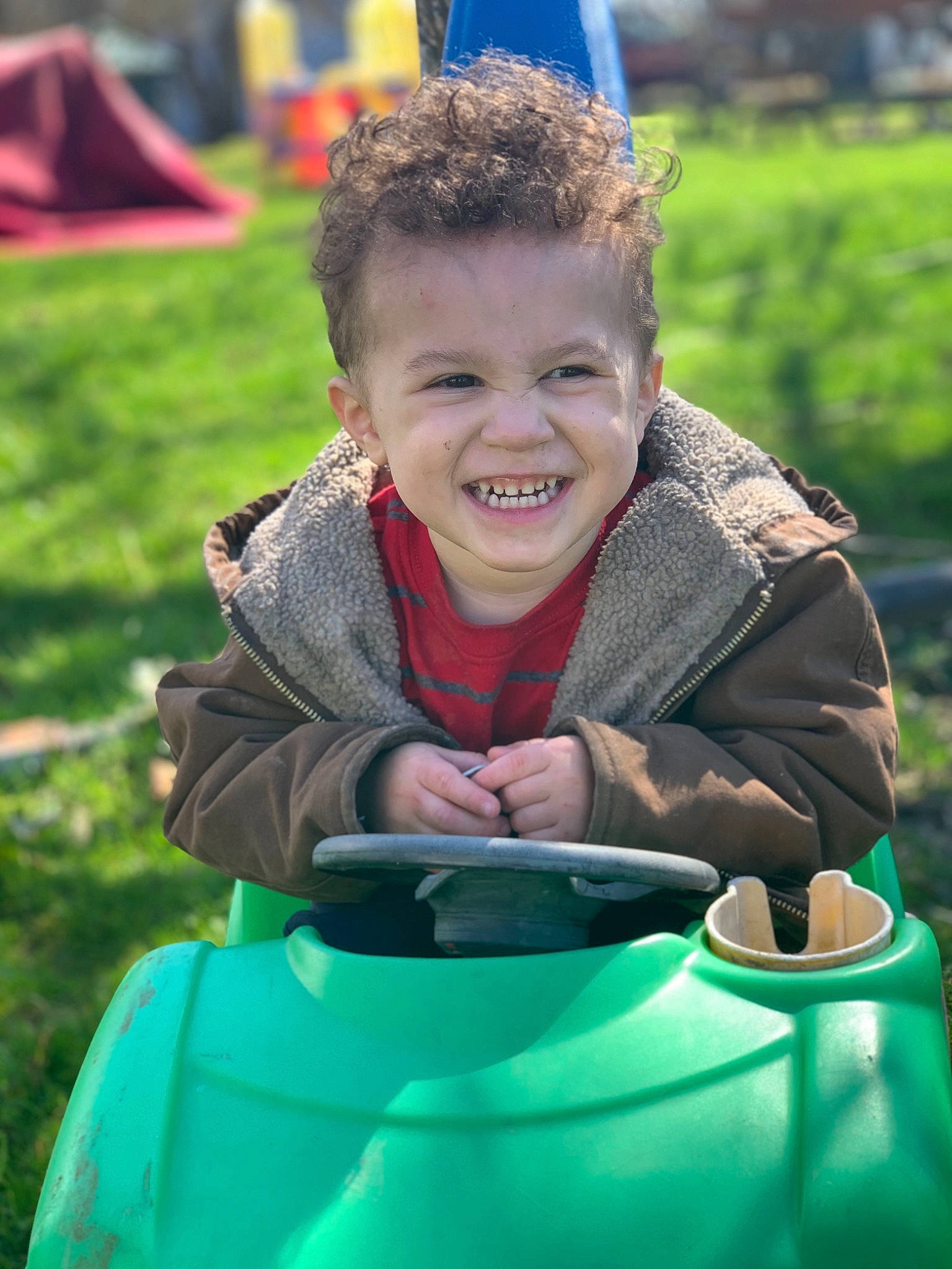 Brayson is registered to the contest to win money with this photo: child, facial_expression, fun, grass, green, happy, joy, laugh, leisure, person, play, playground, recreation, smile, toddler, vacation