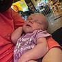 Brooklyn joined the competition — help win amazing prizes! baby, sleeping, infant, onesie, person, arm, hand, indoor, kitchen, furniture, television, teddy_bear, purple_clothing, orange_clothing, relaxing, home, peaceful, child, human, casual