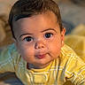 Kai is registered to the contest to win money with this photo: baby, child, infant, yellow_clothing, plaid, face, eyes, mouth, cute, portrait, indoors, soft_light, skin, head, expression, pout, person, young_child, closeup, crawling