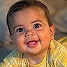 baby, smiling, face, child, yellow_clothing, portrait, closeup, happy, cute, infant, eyes, mouth, skin, person, indoors, soft_light, expression, young_child, head, baby_girl_or_boy