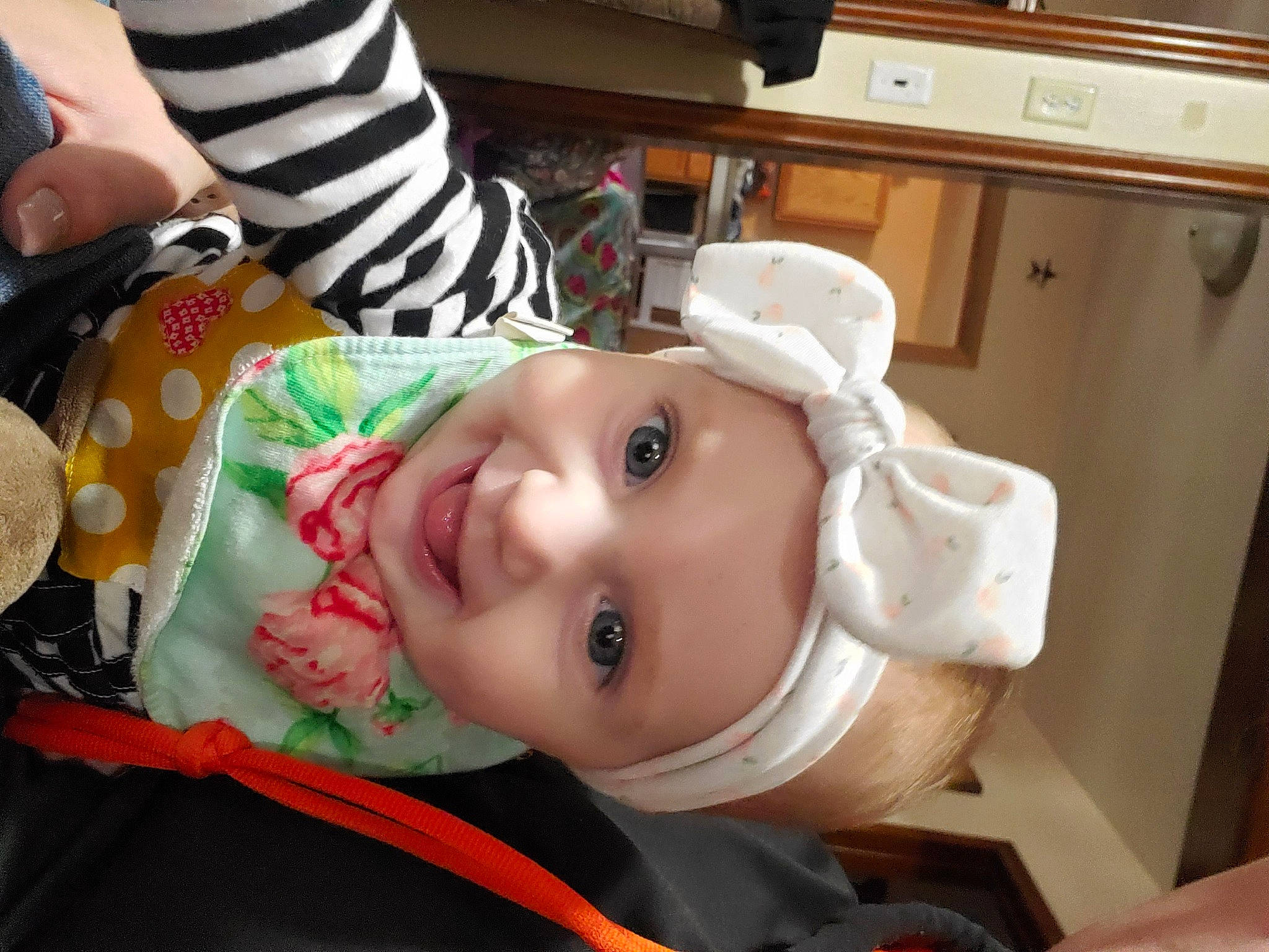 Sarai is registered to the contest to win money with this photo: baby, cabinetry, cheek, child, eyebrow, eyelash, gas_stove, happy, hat, headwear, home_appliance, joy, kitchen_appliance, kitchen_stove, lip, mouth, nose, person, skin, smile