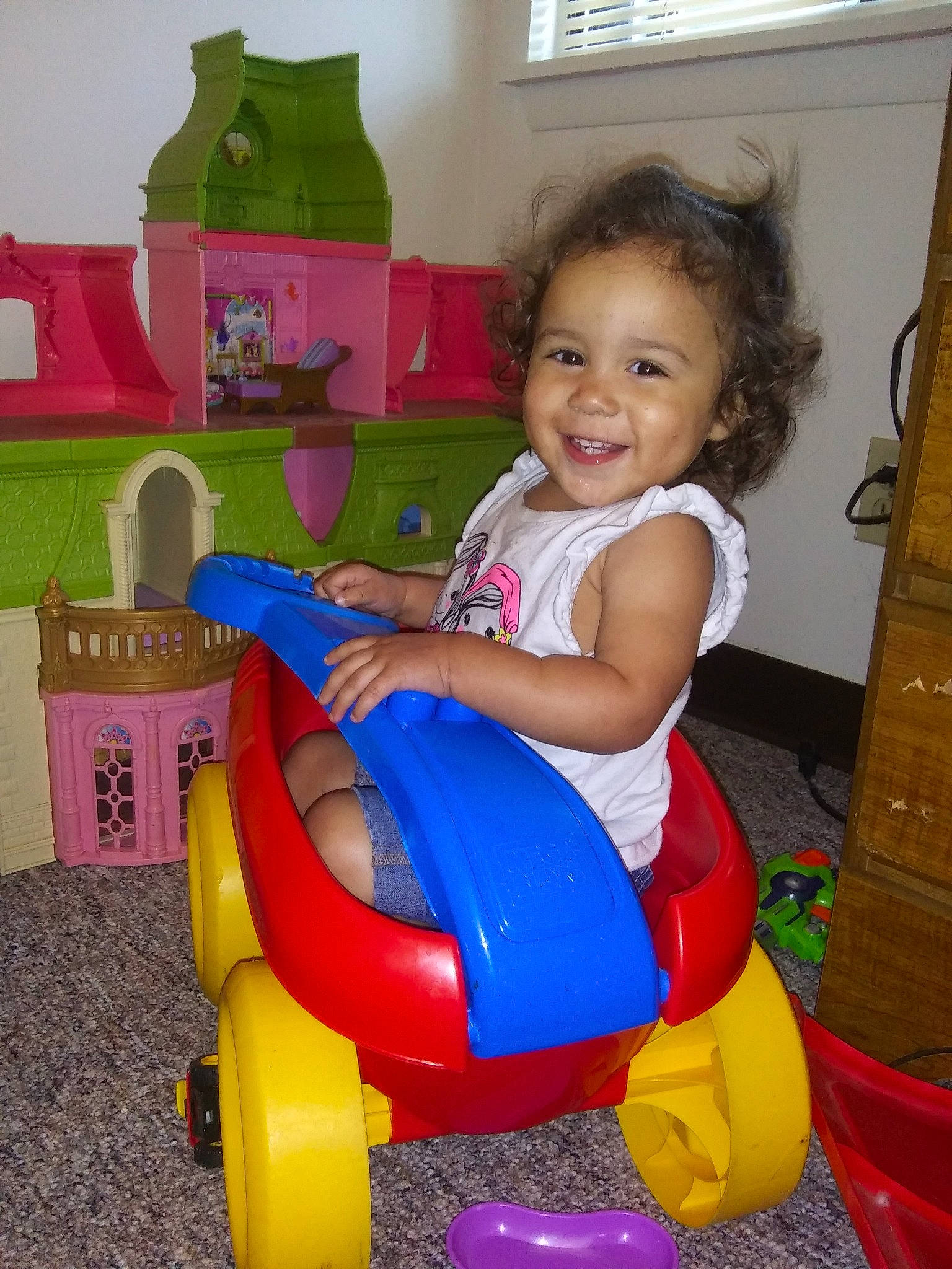 Kennedy is registered to the contest to win money with this photo: baby_playing_with_toys, baby_products, baby_toys, child, fun, joy, person, play, playset, potty_training, product, riding_toy, sitting, smile, toddler, toy