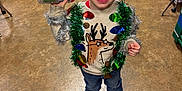 Jonah joined the competition — help win amazing prizes! boy, child, classroom, colorful, festive, floor, furniture, hair, holiday, indoor, jeans, person, play, reindeer, shoes, sippy_cup, smiling, sweater, tinsel, toy