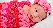 Kaelani joined the competition — help win amazing prizes! baby, baby_toddler_clothing, cheek, child, close_up, crochet, fashion_accessory, flower, hair_accessory, headgear, petal, photography, pink, plant, rose, smile, textile, toddler, wool