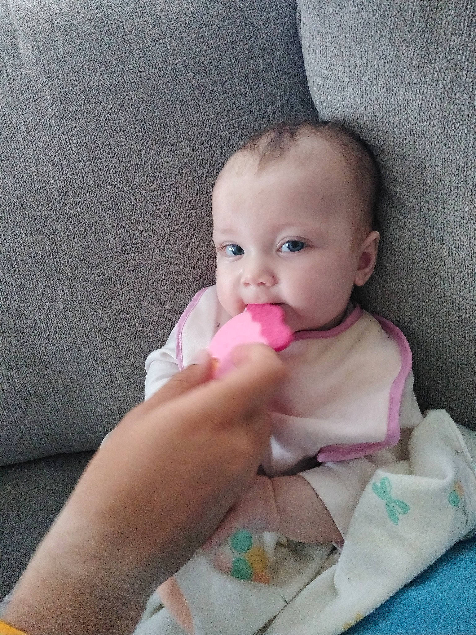 Catherine is registered to the contest to win money with this photo: baby, beauty, cheek, child, electronic_device, eye, face, finger, hand, head, lip, mouth, nose, person, play, product, skin, toddler