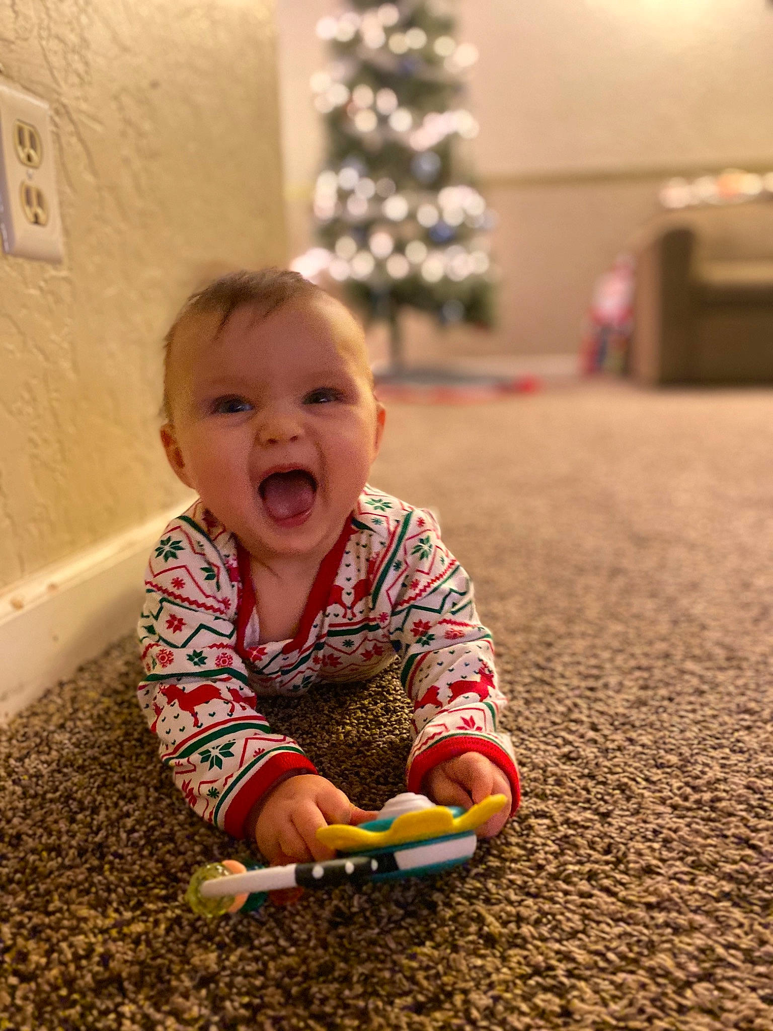 Emmerson is registered to the contest to win money with this photo: baby, cheek, child, facial_expression, fun, happy, laugh, person, play, sitting, skin, smile, toddler