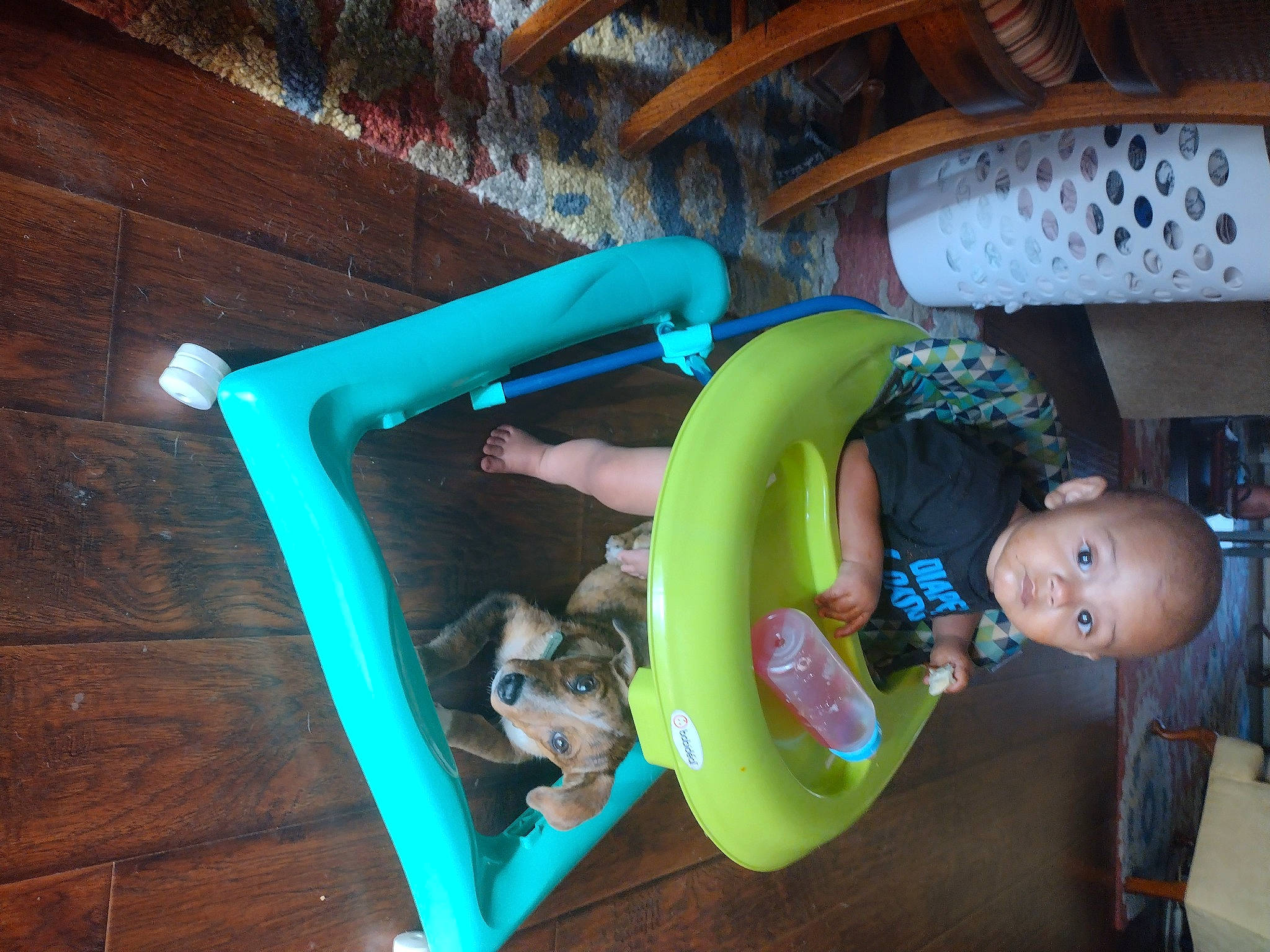 Delonta is registered to the contest to win money with this photo: baby, baby_products, baby_toddler_clothing, child, comfort, electric_blue, flash_photography, fun, leisure, person, play, recreation, room, sitting, t_shirt, toddler, wood