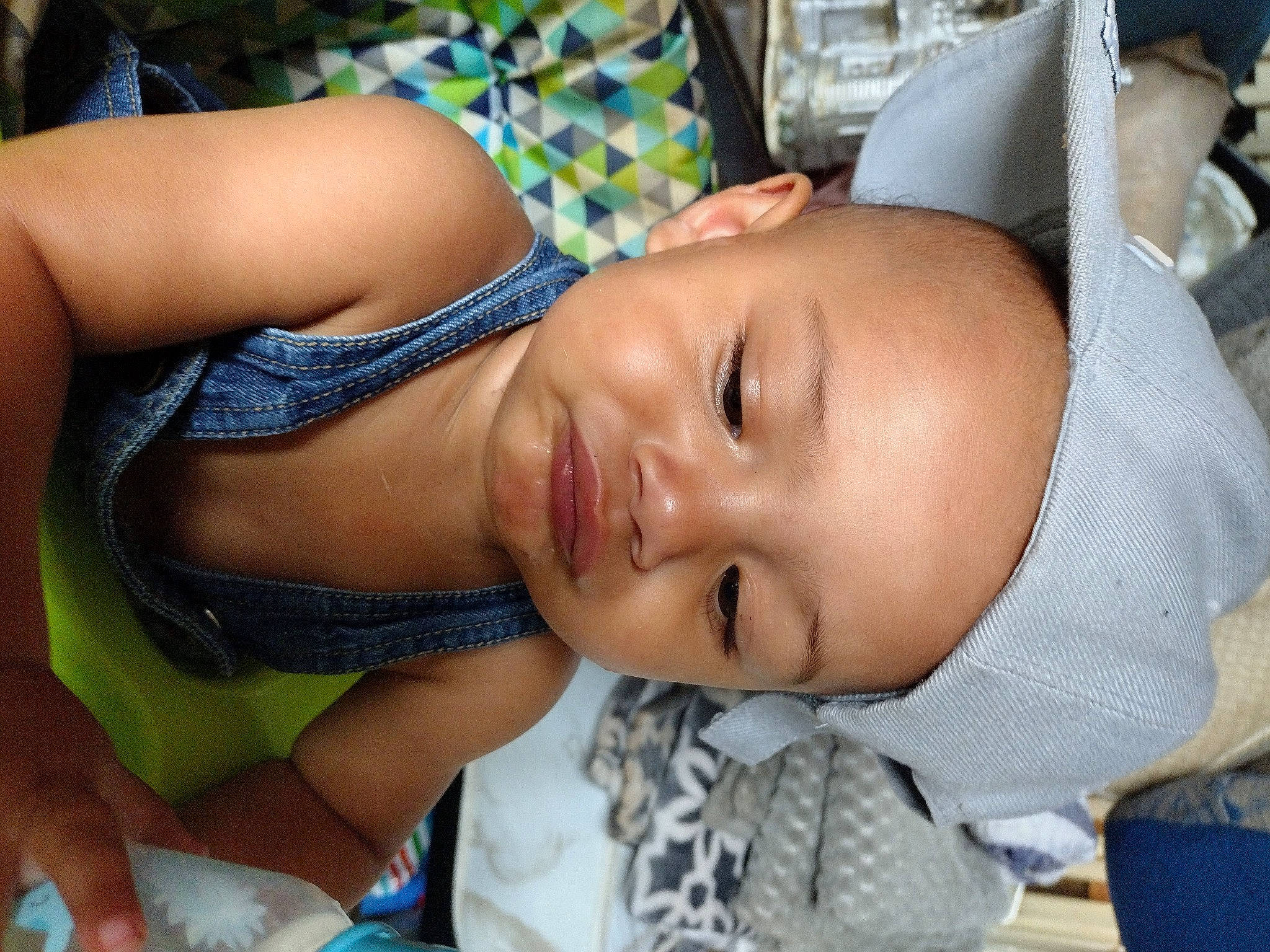 Delonta is registered to the contest to win money with this photo: baby, black_hair, chest, child, cool, elbow, eyelash, happy, hat, leisure, lip, mouth, neck, person, plant, skin, smile, sunglasses, thigh, toddler
