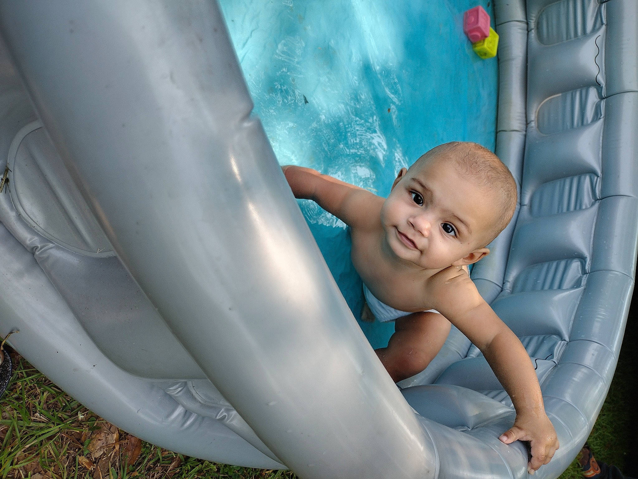Delonta joined the competition — help win amazing prizes! azure, baby, bumper, child, chute, fun, grass, happy, human_leg, inflatable, leg, leisure, person, plastic, play, recreation, sitting, smile, toddler, vacation
