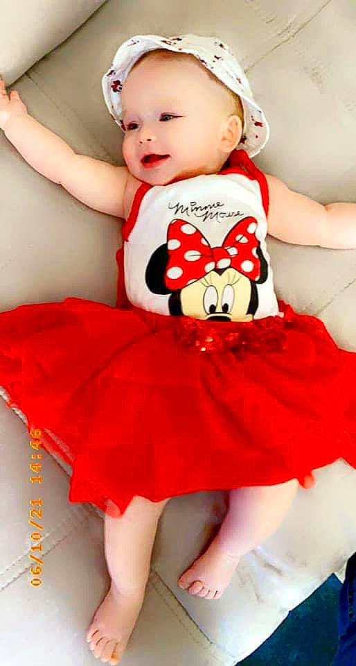 Katalina a rejoint le concours — aidez-le/la à gagner de superbes lots ! abdomen, baby, baby_toddler_clothing, child, costume_hat, day_dress, dress, embellishment, happy, hat, one_piece_garment, person, pink, red, ruffle, skin, sleeve, thigh, toddler, waist