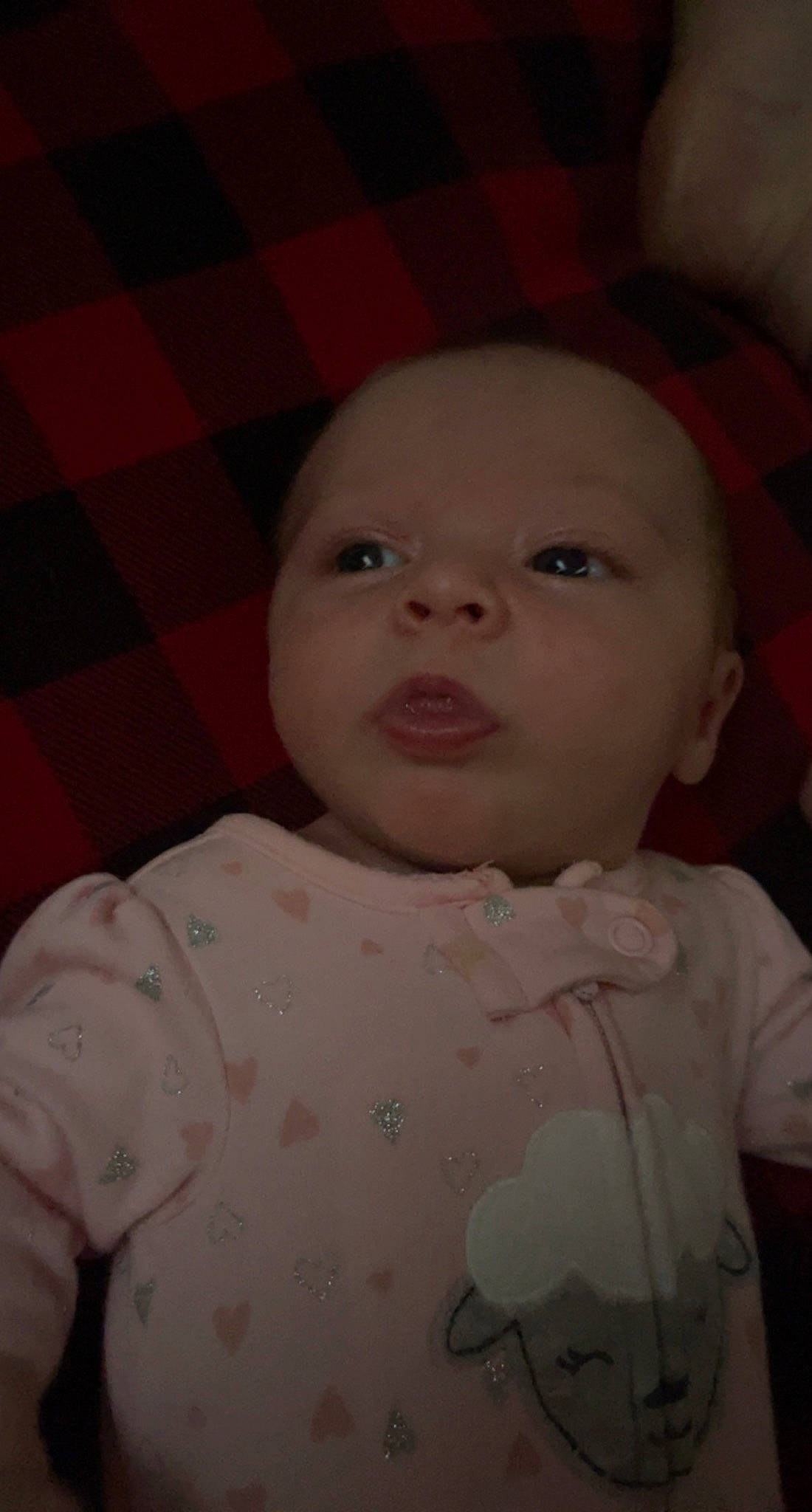 Avah is registered to the contest to win money with this photo: baby, baby_toddler_clothing, cheek, child, chin, eye, eyebrow, forehead, head, iris, lip, mouth, nose, person, pink, plaid, skin, sleeve, tartan, tints_and_shades