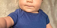 Jasper joined the competition — help win amazing prizes! baby, blue_shirt, child, chubby_cheeks, close_up, curious, cute, expression, eyes, face, hand, indoor, infant, neutral_background, one_person, person, portrait, skin, soft_light, young_child