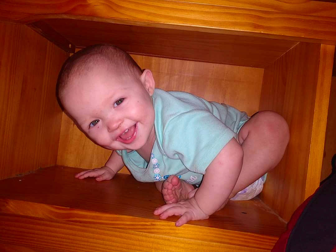 Lilah Rose is registered to the contest to win money with this photo: baby, cheek, child, crawling, eye, face, finger, flooring, hand, hardwood, joy, mouth, nose, person, skin, thumb, toddler, wood