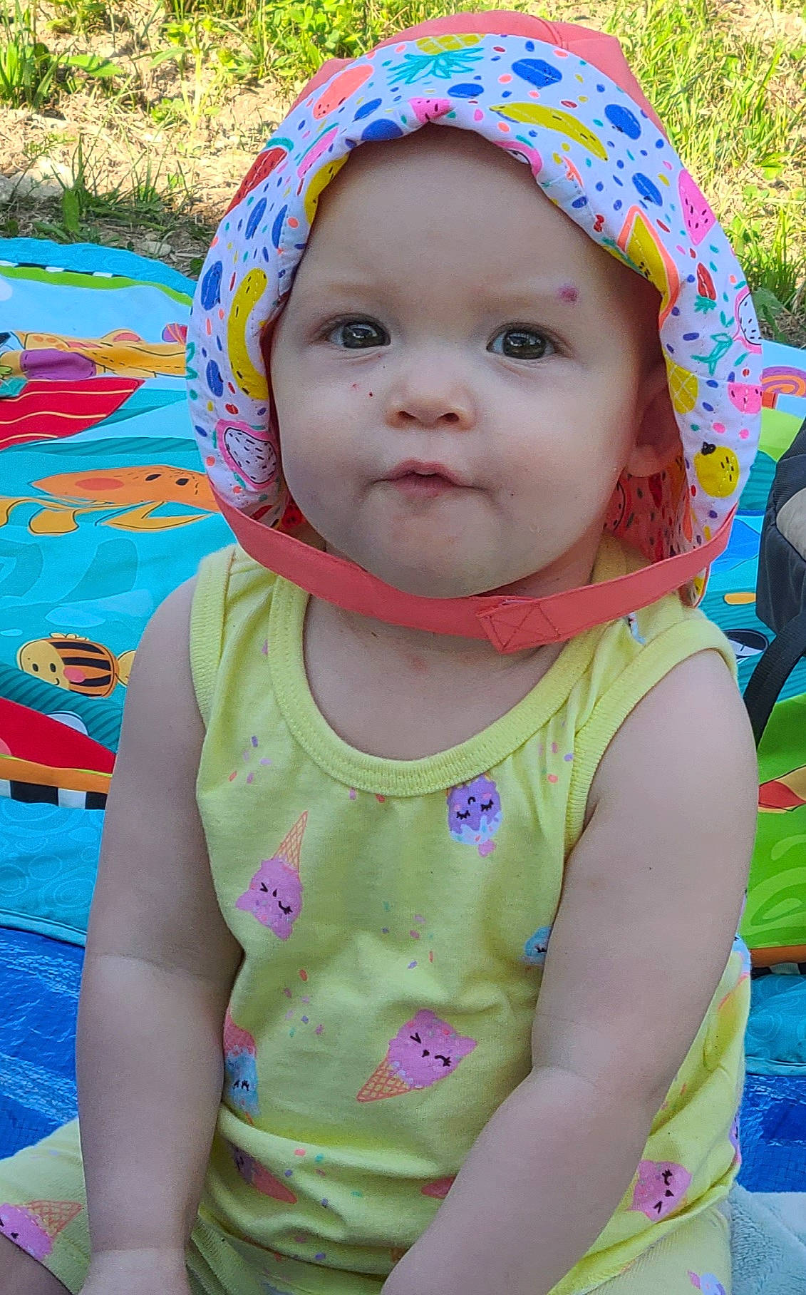 Lily Mae is registered to the contest to win money with this photo: baby, cheek, child, face, fun, head, headgear, headwear, leisure, person, pink, play, skin, smile, summer, sun_hat, toddler, vacation