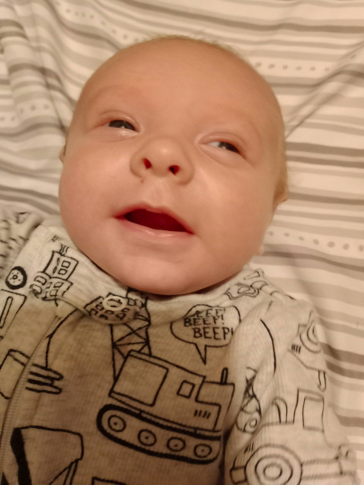 Axel is registered to the contest to win money with this photo: baby, baby_toddler_clothing, cheek, chin, clothing, comfort, eyebrow, face, facial_expression, head, human, lip, mouth, nose, person, product, skin, sleeve, smile, textile