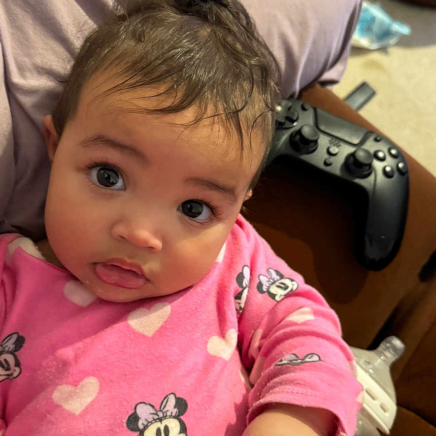 Ayla joined the competition — help win amazing prizes! baby, bodypart, clothing, computer, computerhardware, computerkeyboard, couch, cushion, electronics, face, finger, furniture, hand, hardware, head, homedecor, person, photography, portrait, sitting