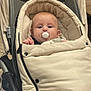 Ronnie-Lee joined the competition — help win amazing prizes! baby, pacifier, stroller, blanket, infant, child, clothing, portrait, cute, indoor, face, person, warm, soft_texture, comfort, seated, baby_gear, head, eyes, hand