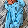 baby, bedspread, blue_onesie, child, clothing, cozy, cute, fabric, indoor, infant, newborn, peaceful, person, plaid_pattern, portrait, relaxed, resting, sleeping, soft, young