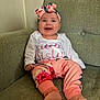 Bonnie joined the competition — help win amazing prizes! baby, child, clothing, couch, cute, family, feet, floral, happy, headband, indoor, infant, person, pink, portrait, relaxed, sitting, smiling, sock, young