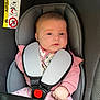 Bonnie joined the competition — help win amazing prizes! baby, car_seat, child, infant, seatbelt, pink_clothing, safety_harness, face, head, person, young_child, indoors, cute, expression, warning_label, car_interior, seat, hands, sitting, portrait