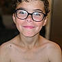 Léonid a rejoint le concours — aidez-le/la à gagner de superbes lots ! child, boy, smile, glasses, curly_hair, face, portrait, shirtless, skin, young, indoors, person, happy, closeup, eyewear, eyeglasses, head_and_shoulders, light_skin, casual, human