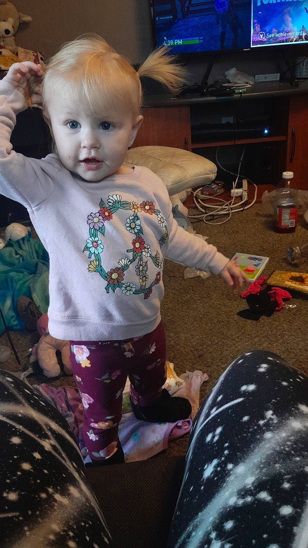 Pyper is registered to the contest to win money with this photo: baby, baby_products, baby_toddler_clothing, cheek, child, computer_keyboard, fun, happy, home_appliance, iris, magenta, pattern, person, play, room, sitting, t_shirt, television, toddler, vacation